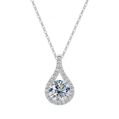 Hebe Teardrop Moissanite Pendant Necklace - round cut moissanite gemstone surrounded by zircon gemstones in teardrop shape. Metal is high quality sterling silver plated in platinum. Elegant design, sparkly necklace, fit for every occasion. 