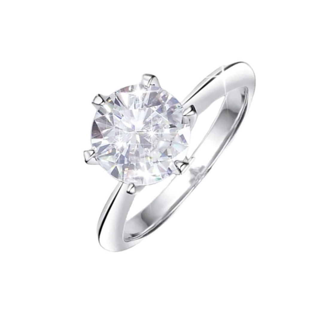 Lyra Round Moissanite Solitaire Ring is a perfect diamond alternative. Set in a 6-prong setting with high quality sterling silver plated in white gold. This ring is sure to dazzle as moissanite gemstone has even more fire than diamond. The beautiful ring comes in a variety of stone sizes for you to choose from.