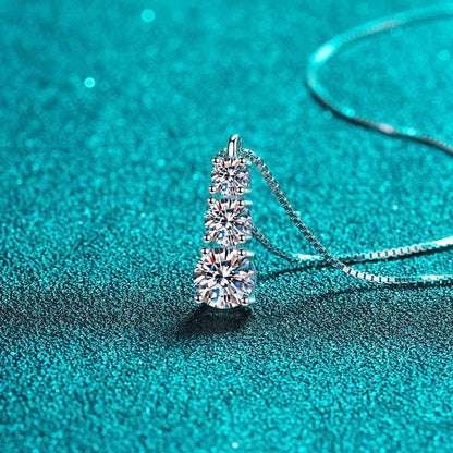 Elara 3-stone Moissanite Pendant Necklace: A stunning piece of jewelry featuring three sparkling moissanite gemstones set in a sleek pendant design. Perfect for adding elegance and sophistication to any outfit.