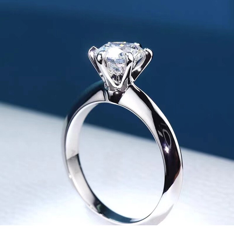 Lyra Round Moissanite Solitaire Ring is a perfect diamond alternative. Set in a 6-prong setting with high quality sterling silver plated in white gold. This ring is sure to dazzle as moissanite gemstone has even more fire than diamond. The beautiful ring comes in a variety of stone sizes for you to choose from.