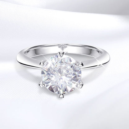 Lyra Round Moissanite Solitaire Ring is a perfect diamond alternative. Set in a 6-prong setting with high quality sterling silver plated in white gold. This ring is sure to dazzle as moissanite gemstone has even more fire than diamond. The beautiful ring comes in a variety of stone sizes for you to choose from.