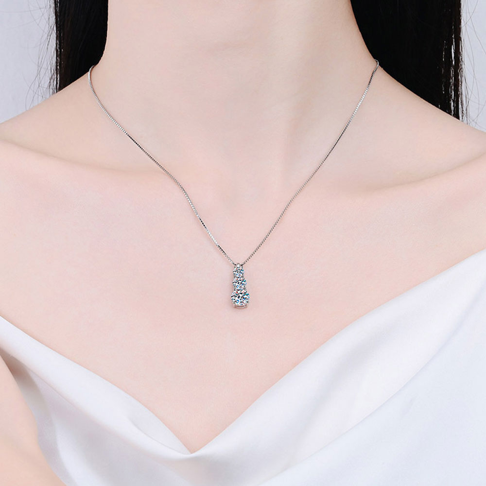 Elara 3-stone Moissanite Pendant Necklace: A stunning piece of jewelry featuring three sparkling moissanite gemstones set in a sleek pendant design. Perfect for adding elegance and sophistication to any outfit.